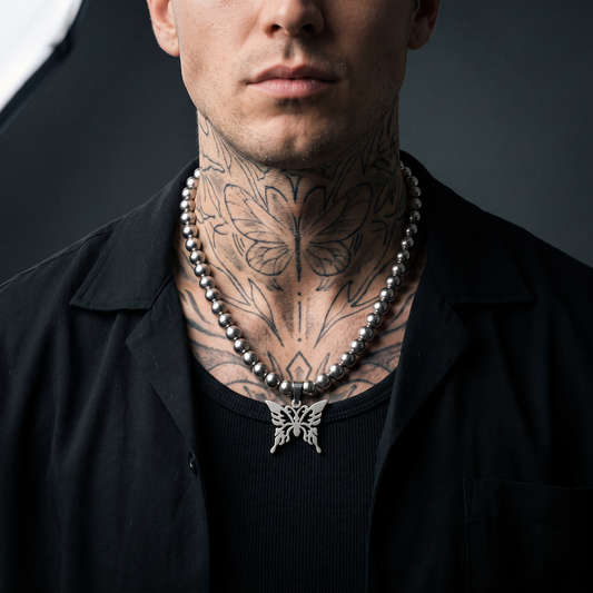 Butterfly Chain worn on model — tattooed male
