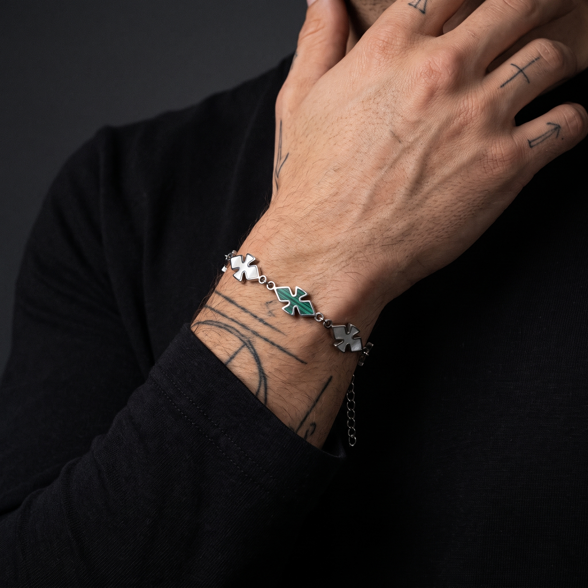 CRSSD Bracelet worn on model — tattooed male