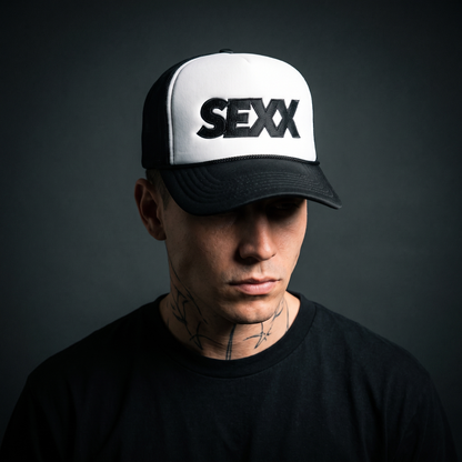 SEXX Trucker Hat worn on model — tattooed male